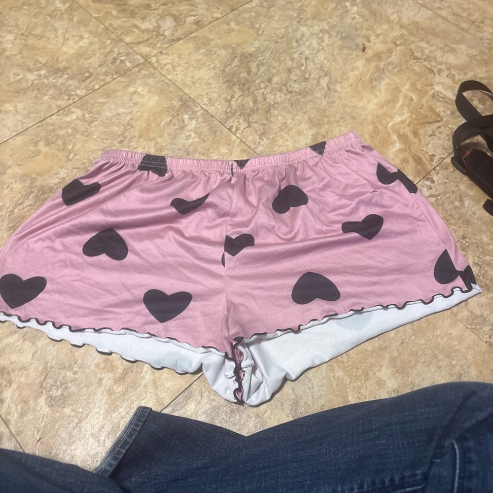Pink with black hearts. Size large.
